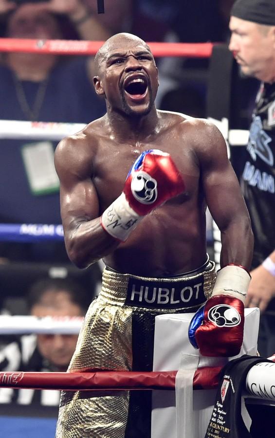 FLoyd Mayweather Jr. celebrates victory by uninimous decision against Manny Pacquaio during the WBC Welterweight Championship at the MGM Grand Garden Arena in Las Vegas on Saturday, May 2, 2015. (Wally Skalij/Los Angeles Times/TNS)