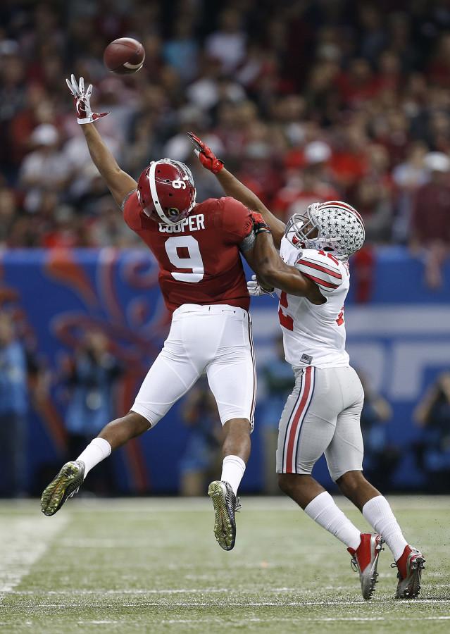Alabama Crimson Tide wide receiver Amari Cooper (9) fails to catch a pass on a third down under pressure from Ohio State Buckeyes cornerback Doran Grant (12) in the first quarter of the Allstate Sugar Bowl and College Football Playoff Semifinal on Thursday, Jan. 1, 2015 at Mercedes-Benz Superdome in New Orleans. (Eamon Queeney/Columbus Dispatch/TNS)
