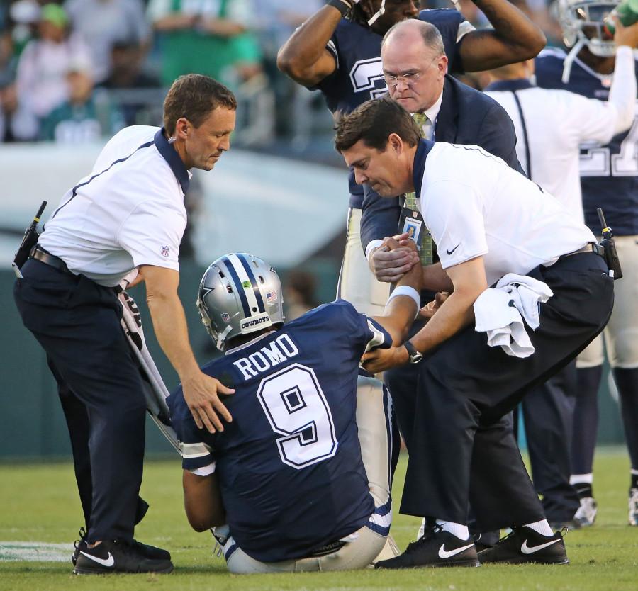 Dallas Cowboys staff lift injured quarterback Tony Romo (9) during the third quarter on Sunday, Sept. 20, 2015, at Lincoln Financial Field in Philadelphia. (Paul Moseley/Fort Worth Star-Telegram/TNS)