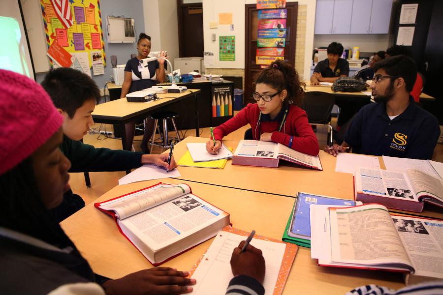 Students Muna Biswa, 17, middle and Zayyan Shaikh, 17, right, work during a health science class at Sullivan High School in Chicago on Thursday, Oct.1, 2015. (Nancy Stone/Chicago Tribune/TNS)