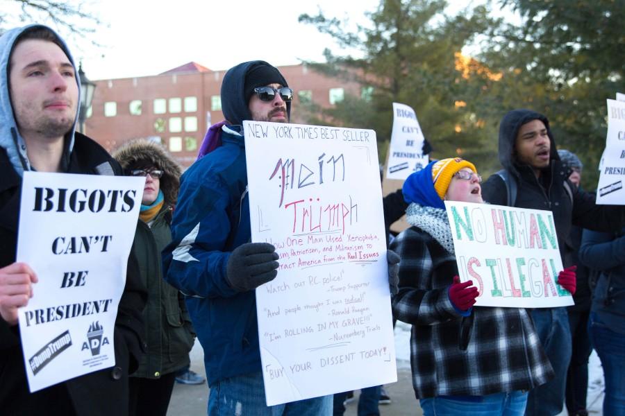 Protesters gather outside of Donald Trumps rally at UNI on Tuesday in what they dubbed the Dump on Trump