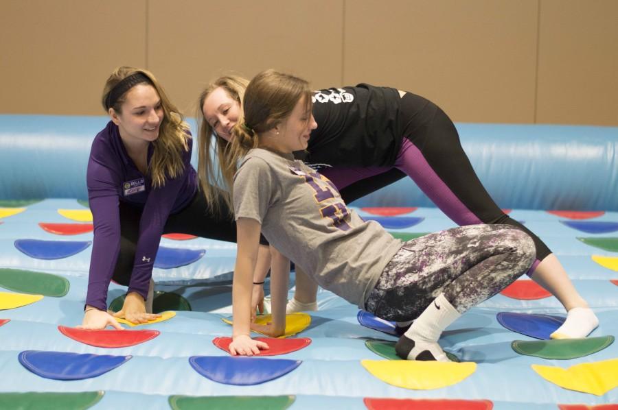 Students get physical by playing Twister. Unlike the traditional Twister played on a mat, this version was inflatable, making it more of a challenge