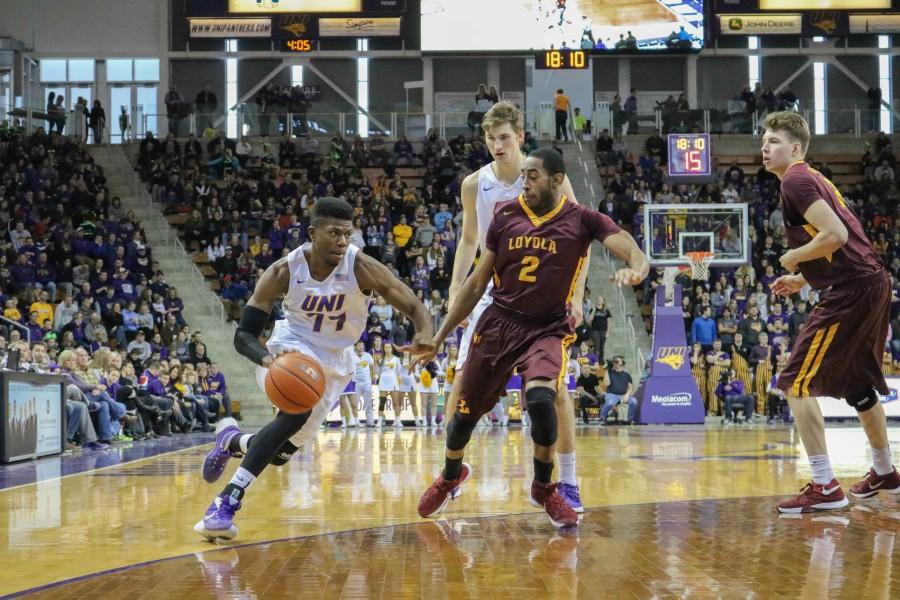 Wes Washpun (11) finished the game with 16 points. Koch, also pictured, finished with a double-double with 22 points and 11 rebounds. 