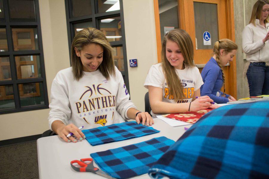 Mikaela Morgan, freshman elementary education major, and Courtney Abolt, freshman business-potential major, created dog toys on Wednesday night. 