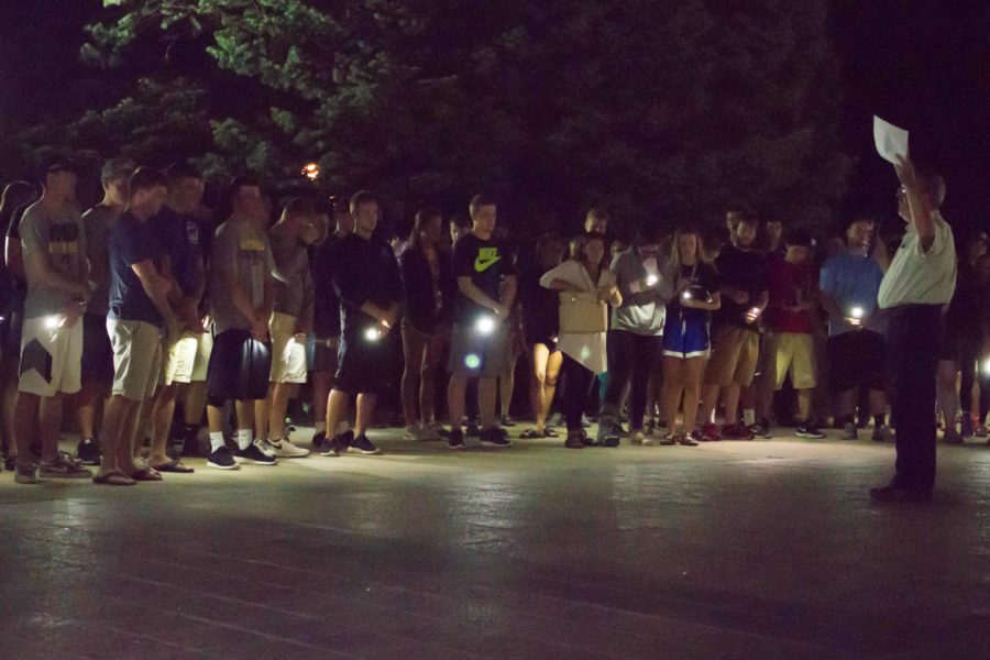 Students surround the campanile with cell phones illuminated to remember Nathan Twedt. Twedt was a sophomore finance major. 