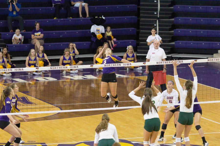Senior Amie Held (3) jumps up to spike the ball against the North Dakota State Bison. The UNI Tournament took place in Cedar Falls where the Panther earned a 3-1 record by the end of the weekend