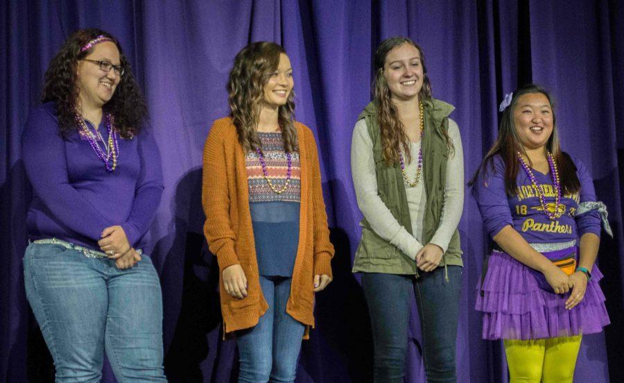 Four of the five homecoming queen candidates stop on stage at the Royalty Competition before their individual performances. Performances included ribbon twirling, lip syncing and more. 