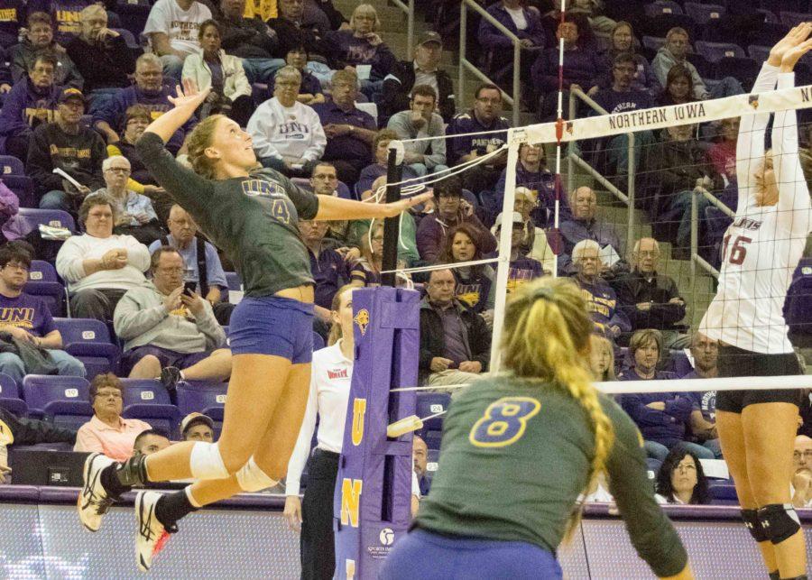 Bri Weber (4) and Ashlee Sinnott (8) set up for a spike against Evansville on Family Weekend. Weber has scored 290 points and recorded 259 kills on the season.