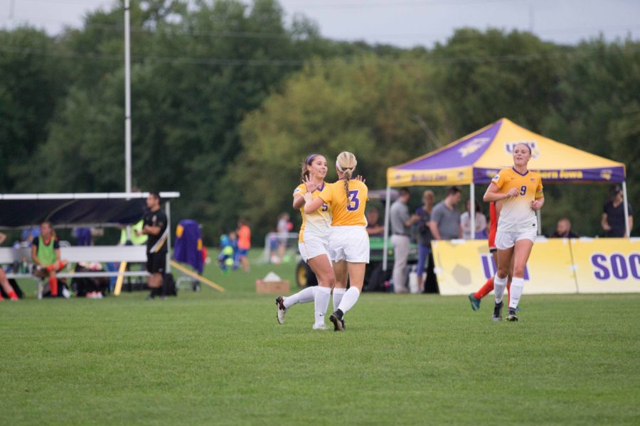 Amber+Nieland+%285%29%2C+and+Sydney+Hayden+%283%29%2C+and+Mary+Brandt+%289%29+celebrate+after+scoring+in+a+recent+home+game+victory.+UNI+is+currently+1-5-1+on+the+road.+