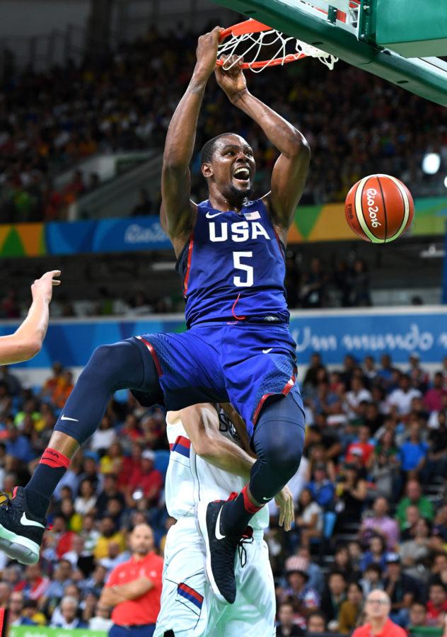 Kevin Durant (5) excitedly dunks the ball during his time with the USA Mens basketball team. Durant is currently a hot topic after he left the Oklahoma City Thunder to play for the Golden State Warriors