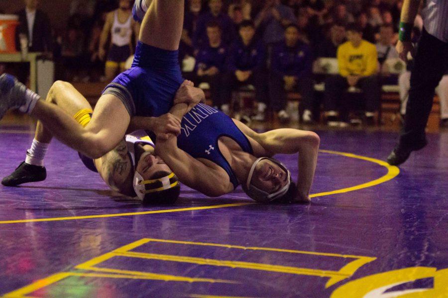 Josh Alber, 133-pound redshirt sophomore, tries for the pin on UNK sophomore Bryce Shoemaker. Alber ended up wining the match by major decision, 15-1. 