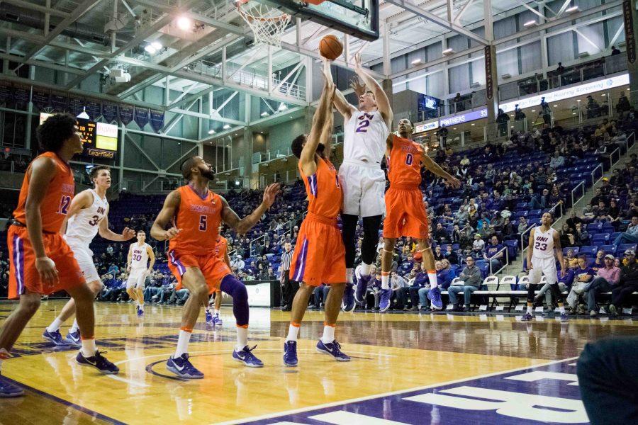 Klint Carlson (2) bodies his way up and over two Evansville defenders. This season, Carlson has recorded 175 total points, 103 rebounds and 45 assists. (He is currently averaging 8.3 PPG, 4.9 RPG, and 2.1 APG)
