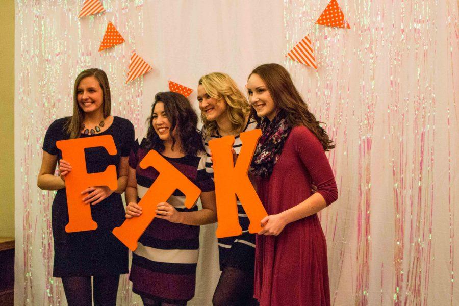 Attendees of the Dance Marathon Black Tie Affair pose with the letter FTK (representing For the Kids). The Black Tie Affair is one of many DM events leading up to the Big Event