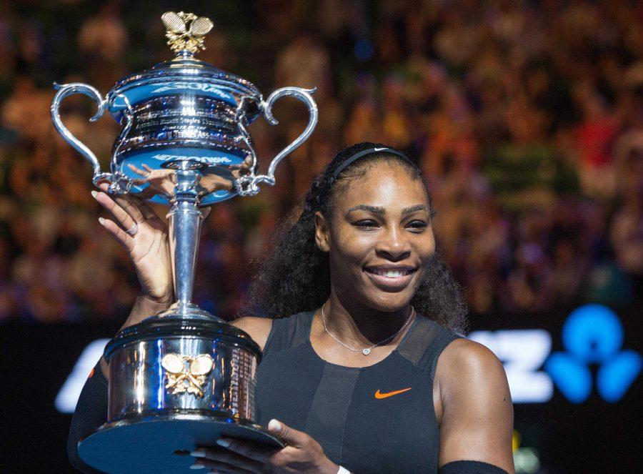 Serena+Williams+holds+up+her+trophy+after+defeating+her+sister%2C+Venus+Williams%2C+in+thew+womens+singles+finals+in+Melbourne%2C+Australia.+