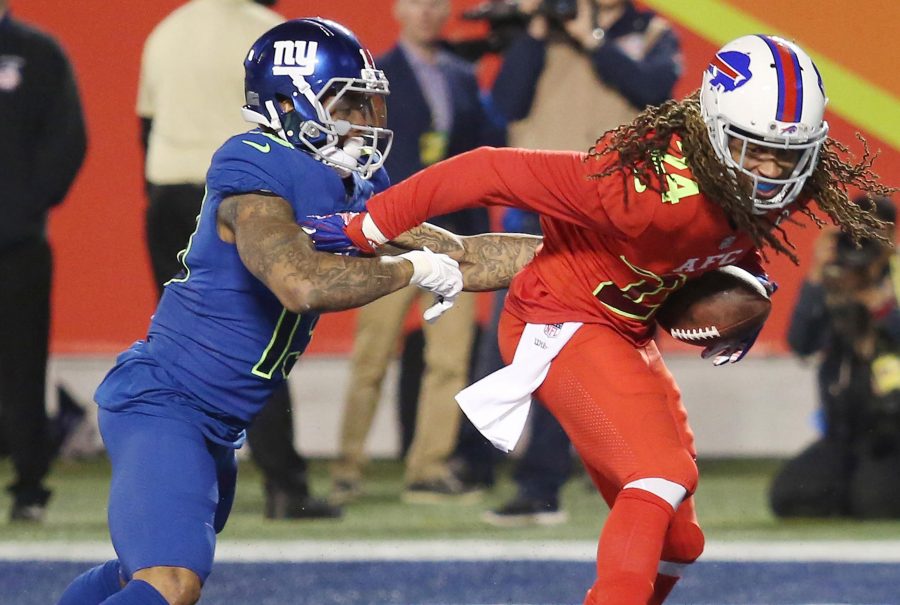 AFC cornerback Stephon Gilmore (right) intercepts a touchdown-scoring pass intended for NFC wide receiver Odell Beckham Jr. (left).