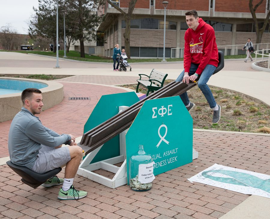 Brandon Lynch (left) and Alex Crum (right) see-saw during Sigma Phi Epsilons 24-hour See SAAW event on Monday, which marked the beginning of the organizations fifth annual Sexual Assault Awareness Week.