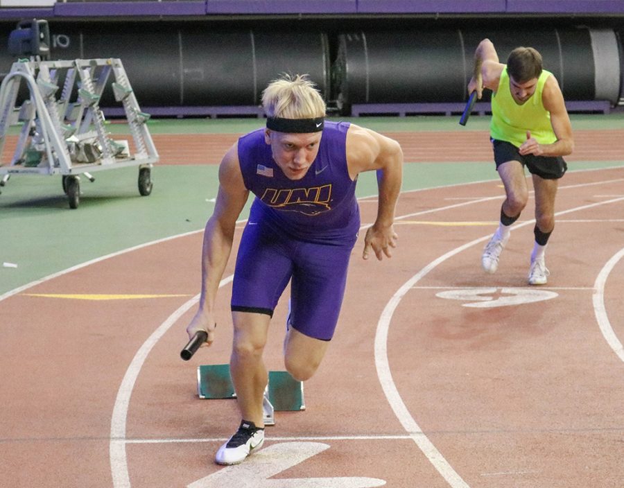 Corey Hertz, sophomore sprinter, takes off in a relay.