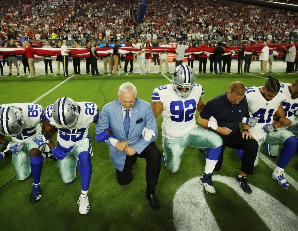 The+Dallas+Cowboys+took+a+knee+during+the+national+anthem+before+their+game+against+the+Arizona+Cardinals.