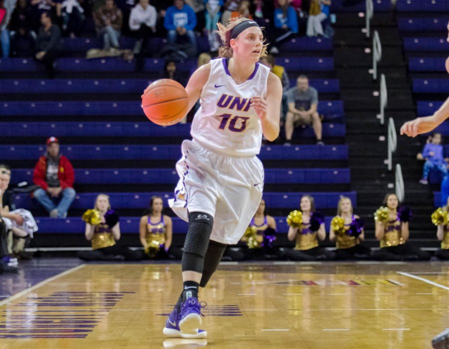 Ellie Howell (10) dribbles down the court and looks to pass.