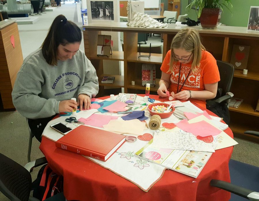 Students decorate participating books in the Blind Date with a Book program at Rod Library.