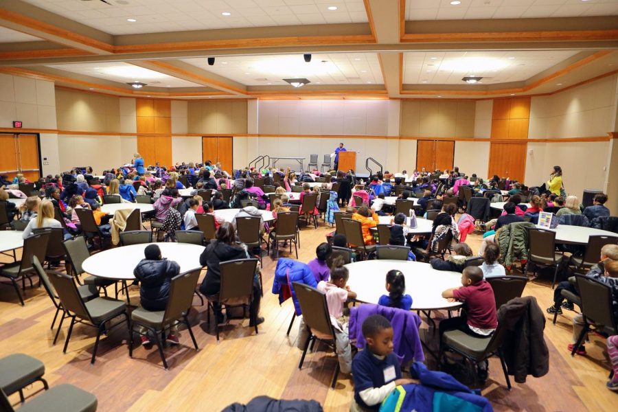 Elementary school students listen attentively at last years African-American Read-In, now in its 12th year.