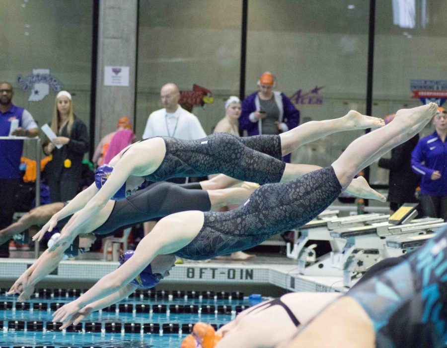 UNI swimmers launch from the starting blocks during last season's MVC Championship meet in Iowa City. The Panthers finished third at the meet under first year head coach Nick Lakin. 