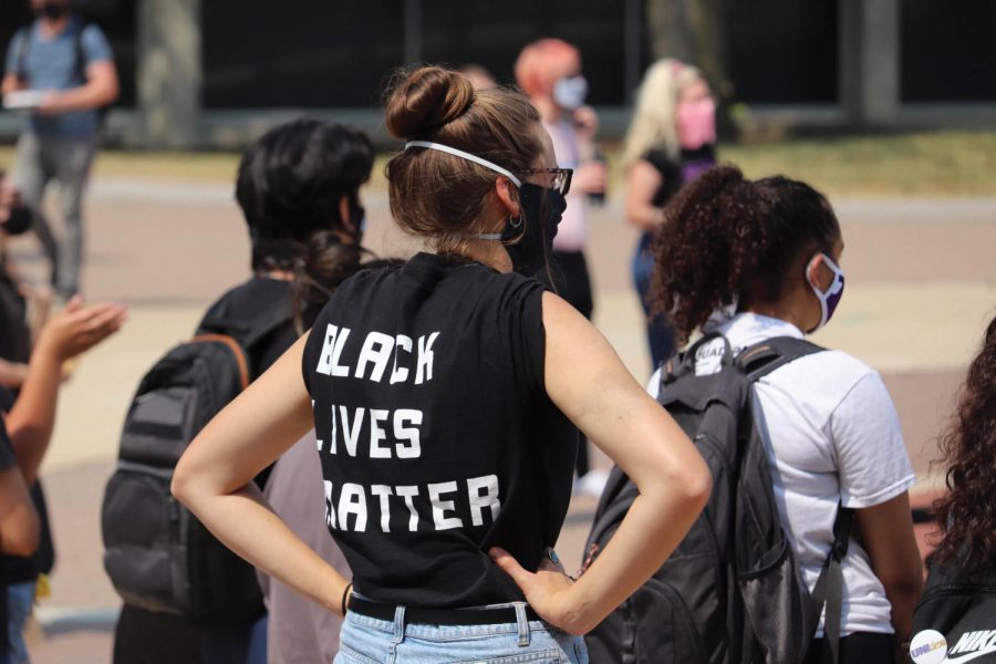 Student listens to a speaker during a Black Lives Matter march and protest outside Maucker Union on Monday, Aug. 24