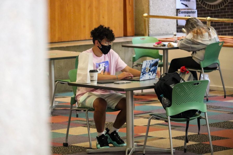 Students study in Maucker Union while wearing masks. The UNI Student Health Center has released its second week of COVID-19 data, indicating a slight decline in the campus positivity rate and number of positive tests.