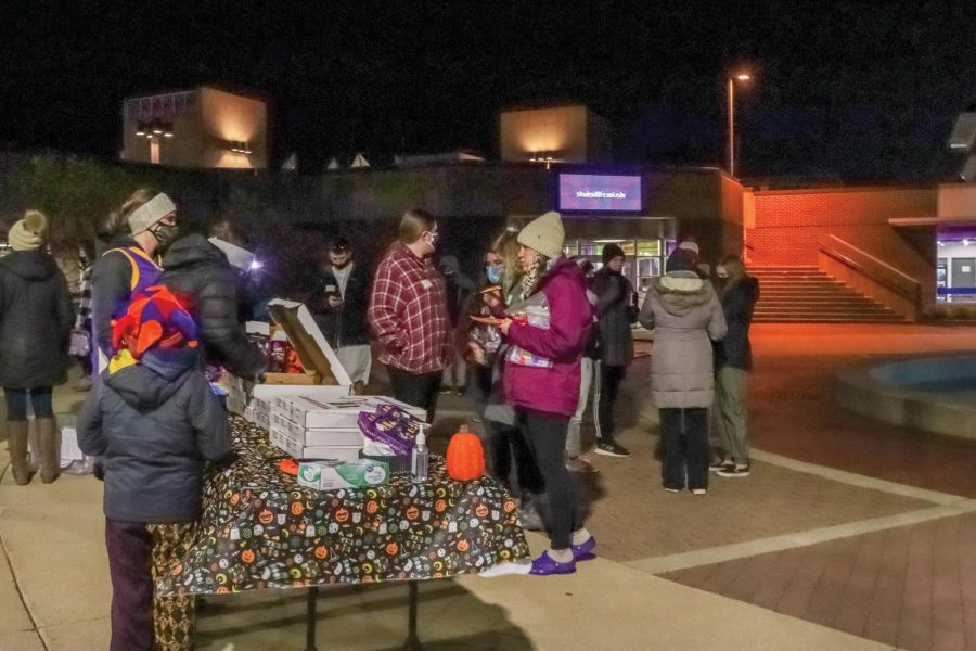 Student Elementary and Early Childhood Association members hand out treats during their costume contest and scavenger hunt.