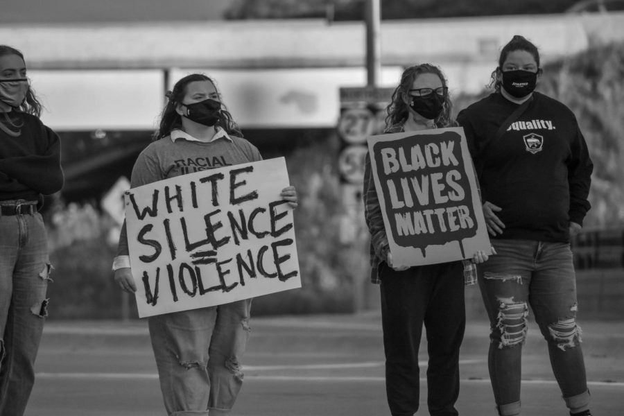 The Cedar Valley community marches on Main Street holding signs in support of the Black Lives Matter movement. 