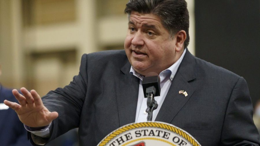 Illinois+Governor+J.B.+Pritzker+signed+a+controversial+bill+into+law+on+Feb.+22+that+addresses+police+brutality+and+discrimination.