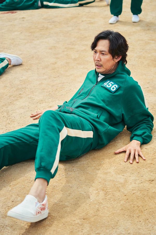 Player 456, also known as Seong Gi-hun, is played by Lee Jung-jae and is seen on the floor frozen during the early games.