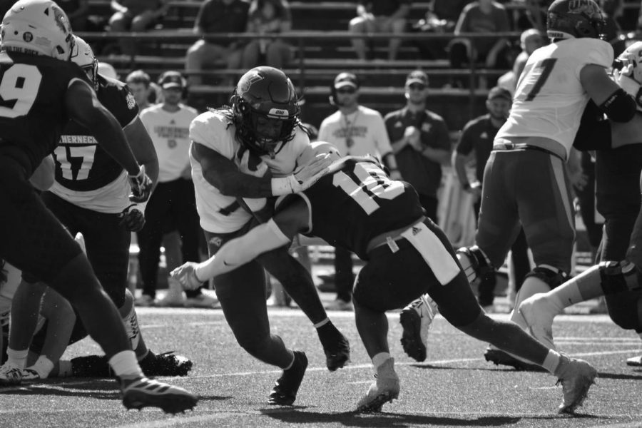 Dom Williams (7) runs with the football during UNIs 52-17 victory over Western Illinois on Saturday. Williams carried the ball 14 times for 69 yards and a touchdown. 