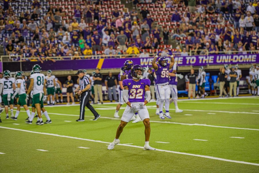 Woo Governor (32) celebrates after a defensive stop while teammates celebrate in the background. Governor finished the game with eight tackles. 