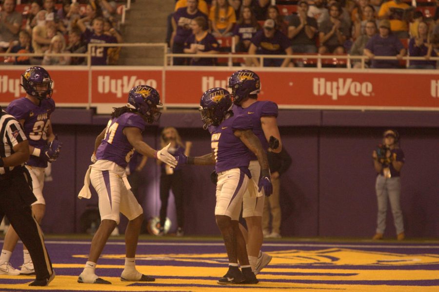 Dom Williams (7) celebrates with Desmond Hutson (81) after Williams scored one of his four rushing touchdowns in the win. 