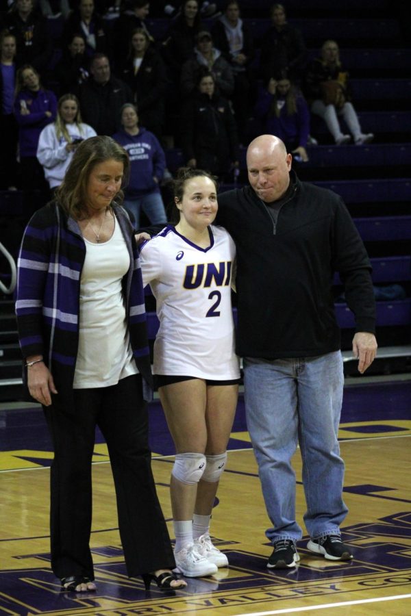 Sydney Petersen, alongside her mother, UNI volleyball Head Coach Bobbi Petersen, as well as her father, Duane Petersen, on Senior Night.