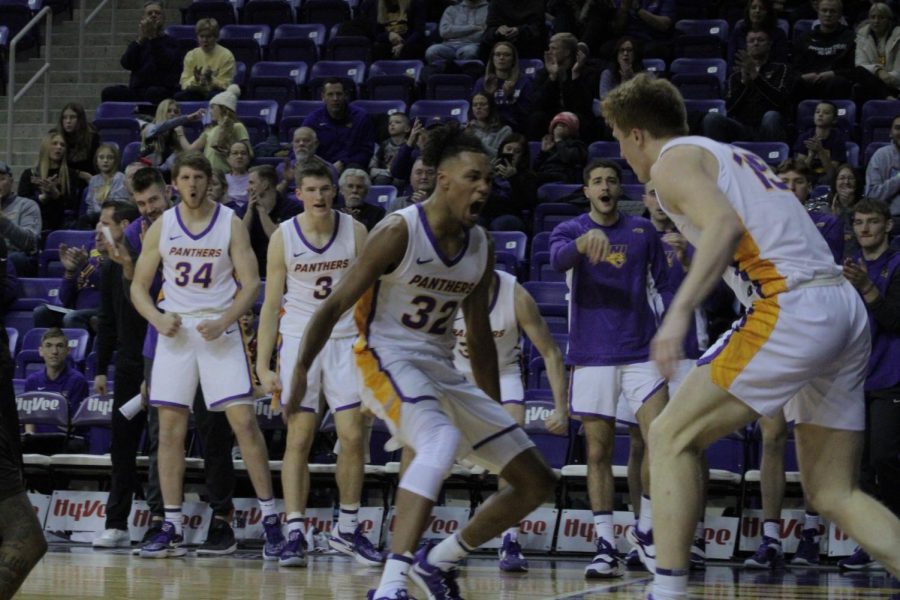 Tytan Anderson (32) celebrates with Michael Duax (15). Anderson had a career-high 25 points on Wednesday to go with 10 rebounds.