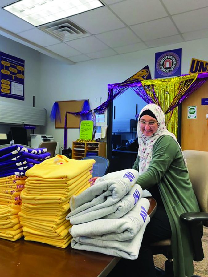 NISG President Leila Mašinović sits with the supply of newly-ordered NISG merch, which will be given out as prizes for the winners of UNI trivia at Mondays launch event. 