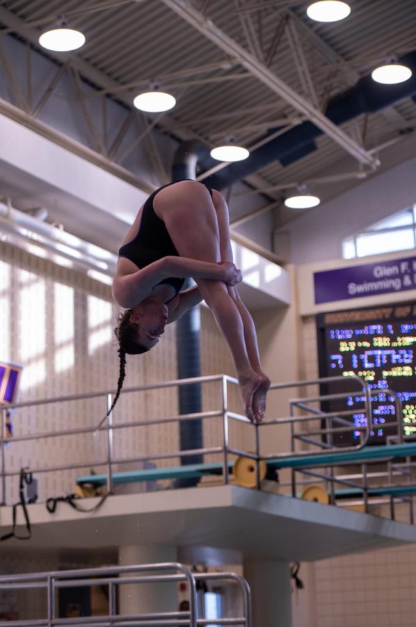 Taylor Hogan performs a dive, Hogan had a season-best score in both the 3-meter and 1-meter dive events, taking second place in both. 