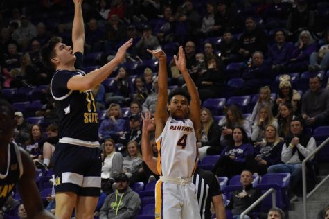 Trey Campbell (4) attempts a 3-pointer for UNI. Campbell was UNIs leading scorer against Belmont, finishing with 16 points. 