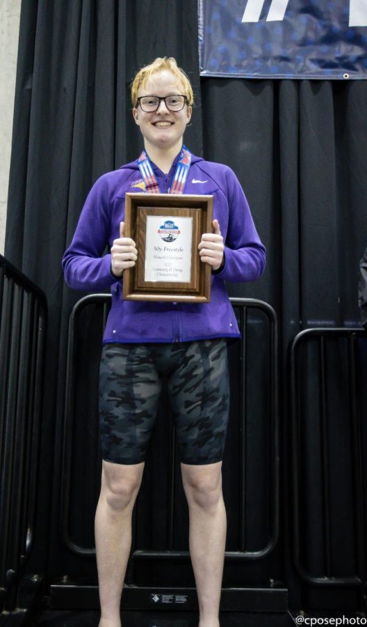 Faith+Larsen+with+her+championship+plaque+from+the+50-yard+freestyle.+