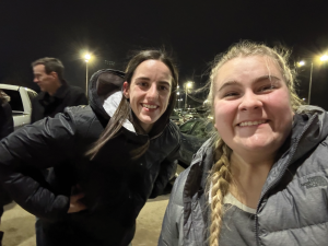 Opinion columnist Abigail Saathoff (right) with Caitlin Clark (left) outside of the Carver Hawkeye Arena before an Iowa men’s basketball game.