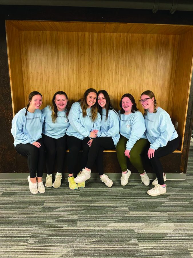 UNI’s Panhellenic Council works behind the scenes to coordinate sorority life as a whole. Cassie Williams, second from left, Laura Harms, third from right and Ana Muell, second from right, shared how sorority life has empowered them as young women pursuing an education.