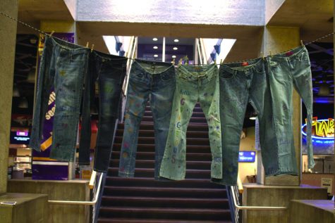 Inspirational messages are written on different sizes of jeans to help normalize the conversation around embracing body image and size. 