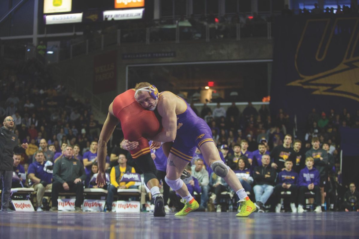 184-pound wrestler, Parker Keckeisen, competes in last year’s home meet
against Iowa State. Over these past few months as the team was forced
to change training facilities, he says the team has come together and has
each others’ backs.
