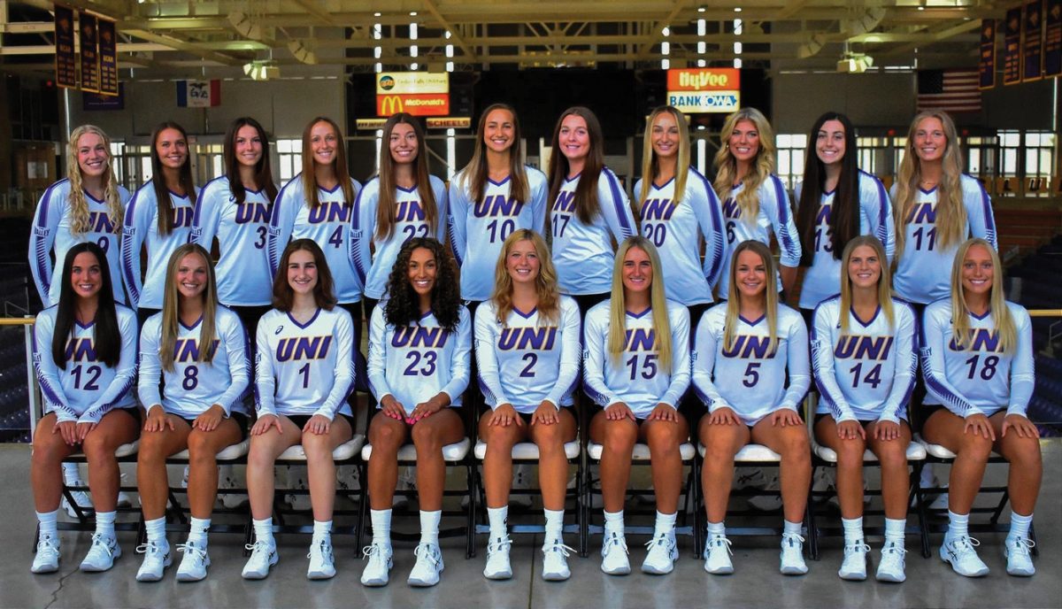The Volleyball team poses for a team photo. The team finished with a 26-7 regular season record as well as the title of MVC Champions.