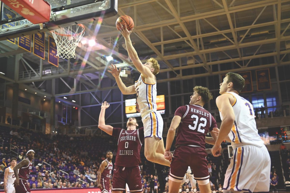 Michael Duax (15) soars above the court during the mens basketball game against Southern Illinois on Saturday, Jan. 20.