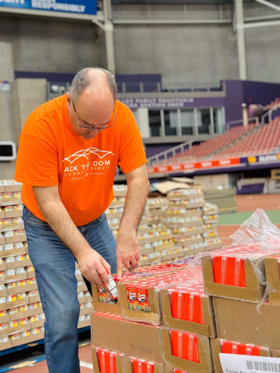 Volunteers from across the Cedar Valley braved the cold weather to help the Northeast Iowa Food Bank pack bags
for children who struggle with food-insecurity.