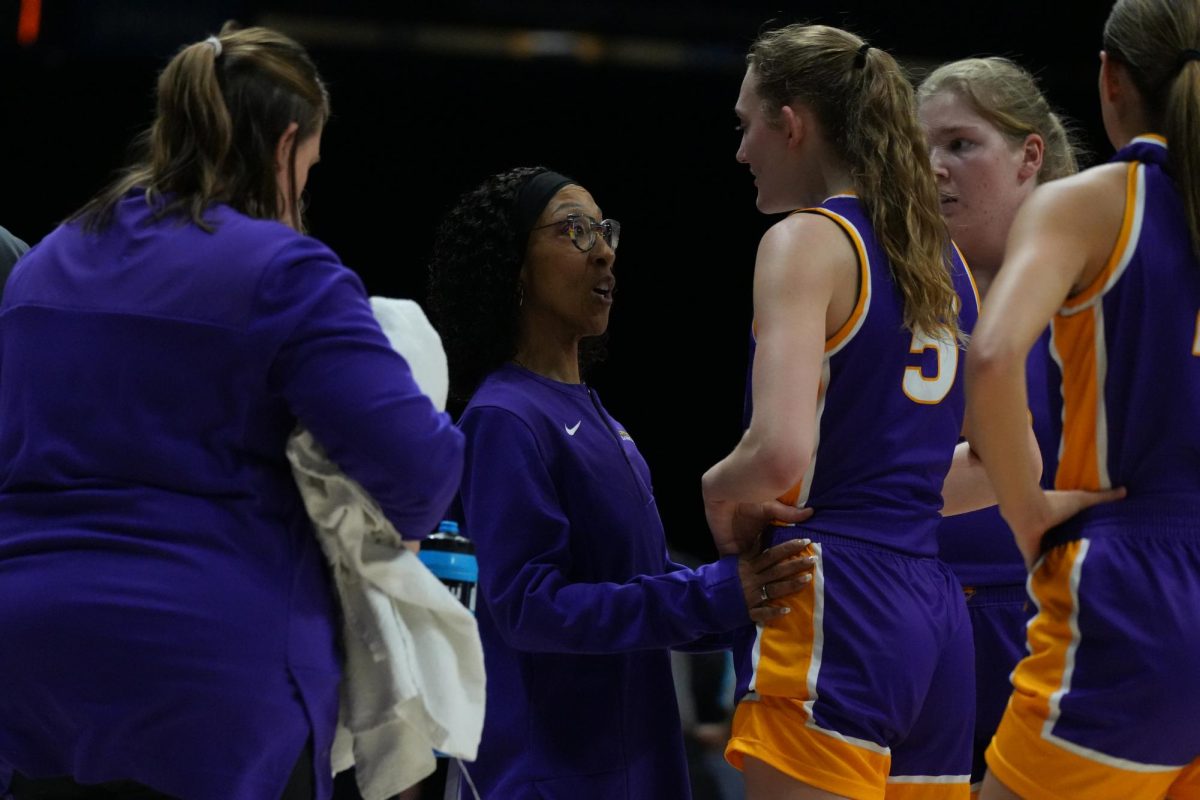 Warren stepped into the role of head coach at UNI in 2007—her first collegiate head coaching position. She was the first Black woman to coach basketball in the Missouri Valley Conference and was the first Black woman to become a head coach of any sport at UNI.