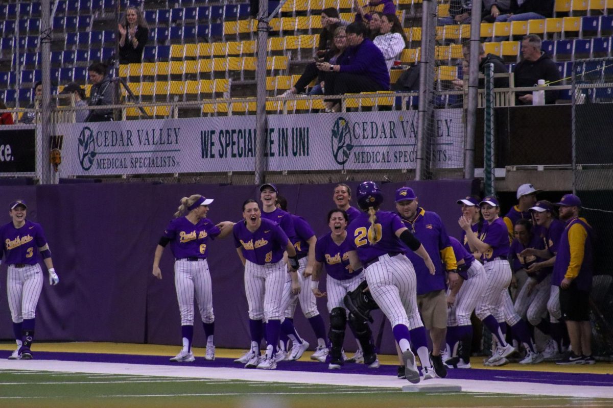 The dugout clears out to cheer on their teammates.